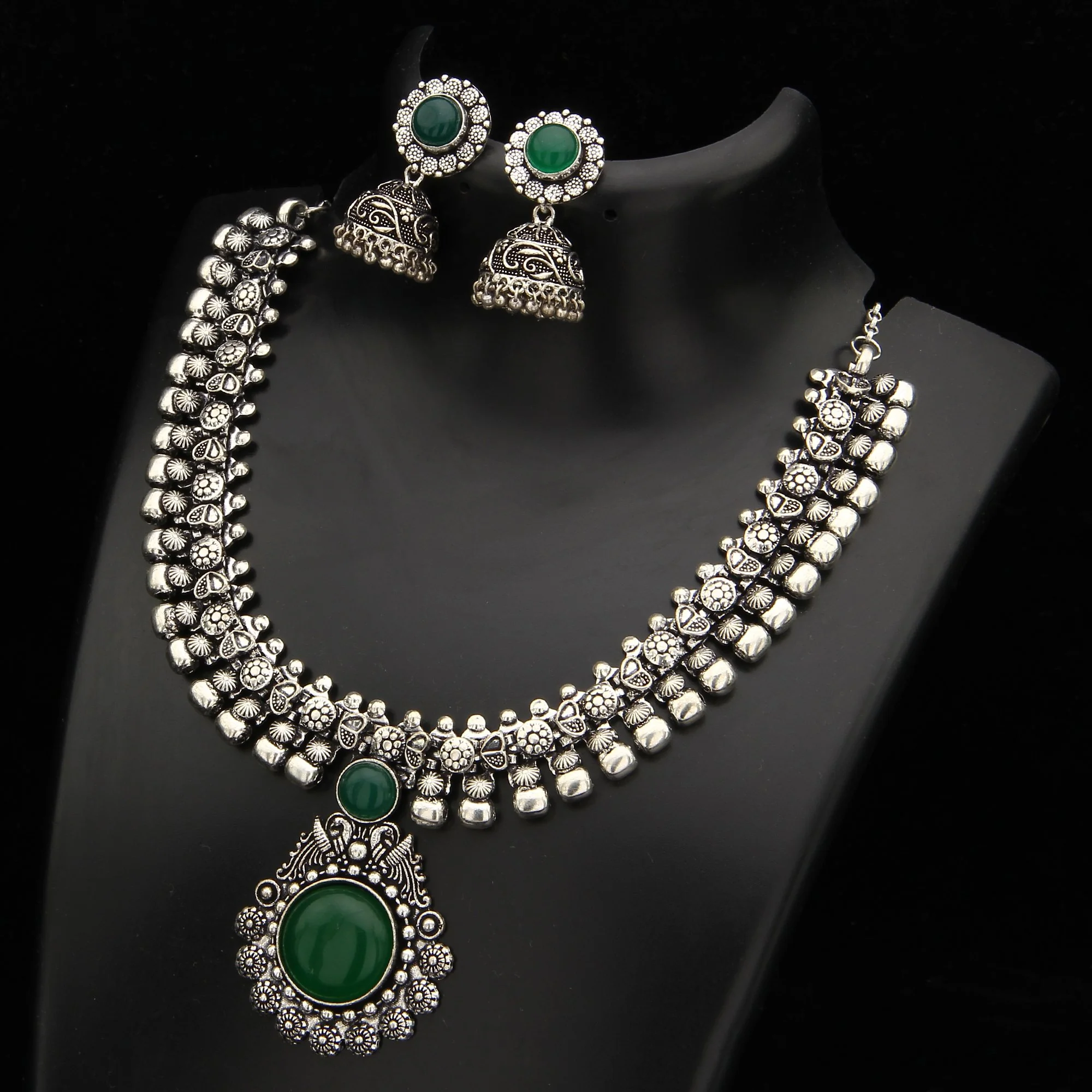 Haarini Oxidised Silver Stones Peacock Pendant and Floral Jhumka Necklace Jewellery Set - Image 3
