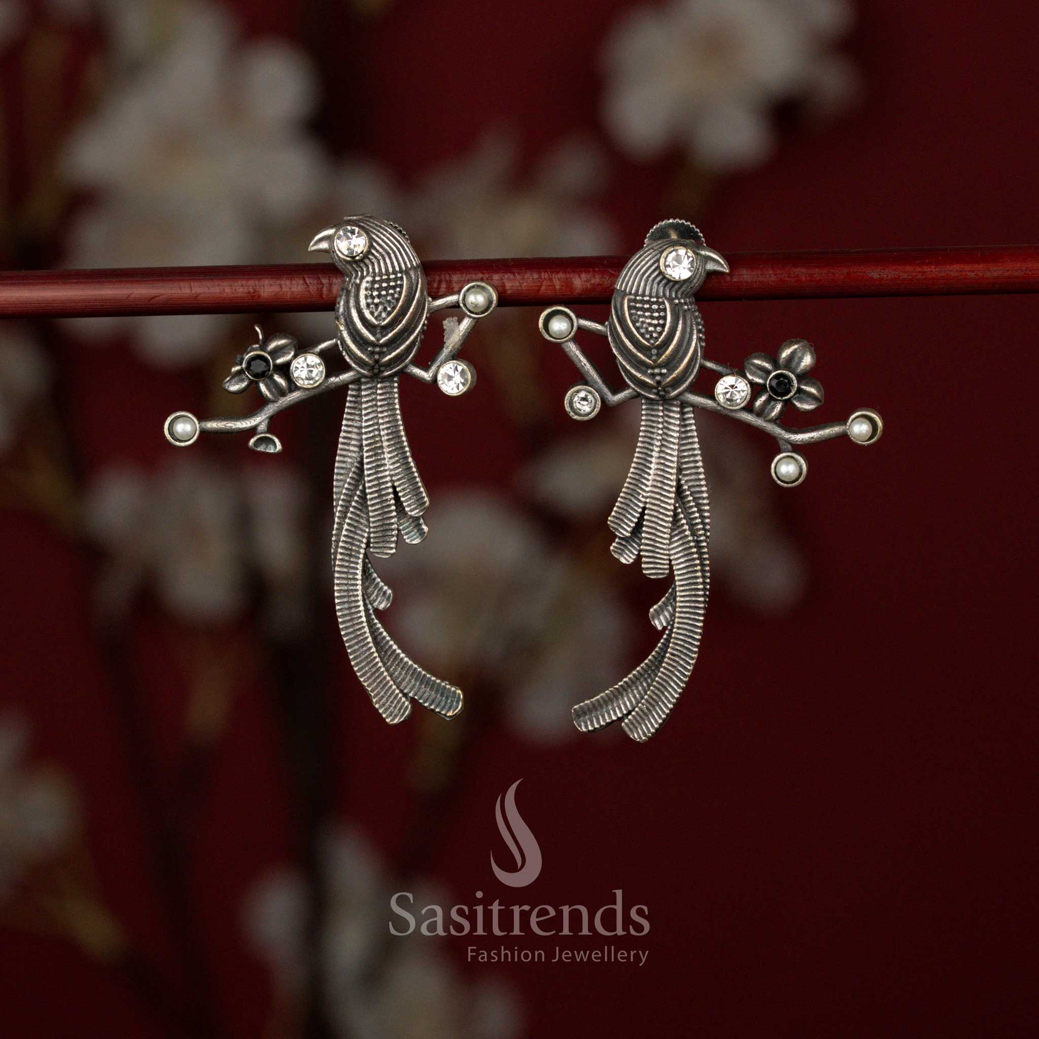 Oxidised German Silver Stone Earrings with Twin Bird Motif, Layered Feather Texture, Branch-Inspired Structure and Sculpted Detailing