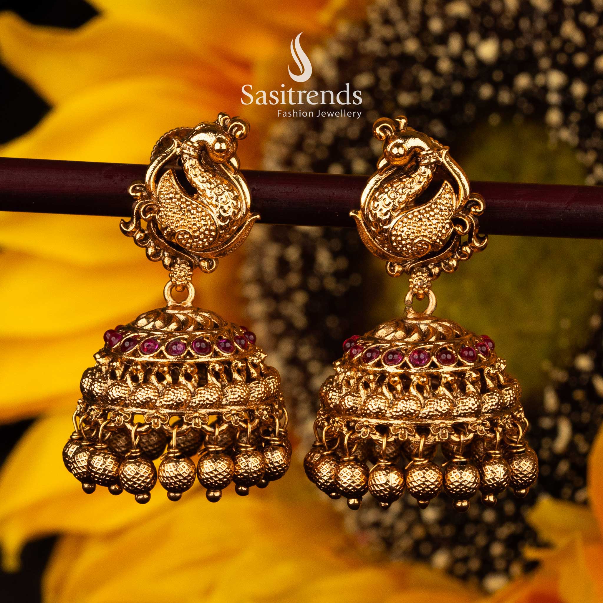 Traditional Peacock Motif Temple Matte Gold Jhumka Earrings with Ruby and Green Stones - Sasitrends - Image 2